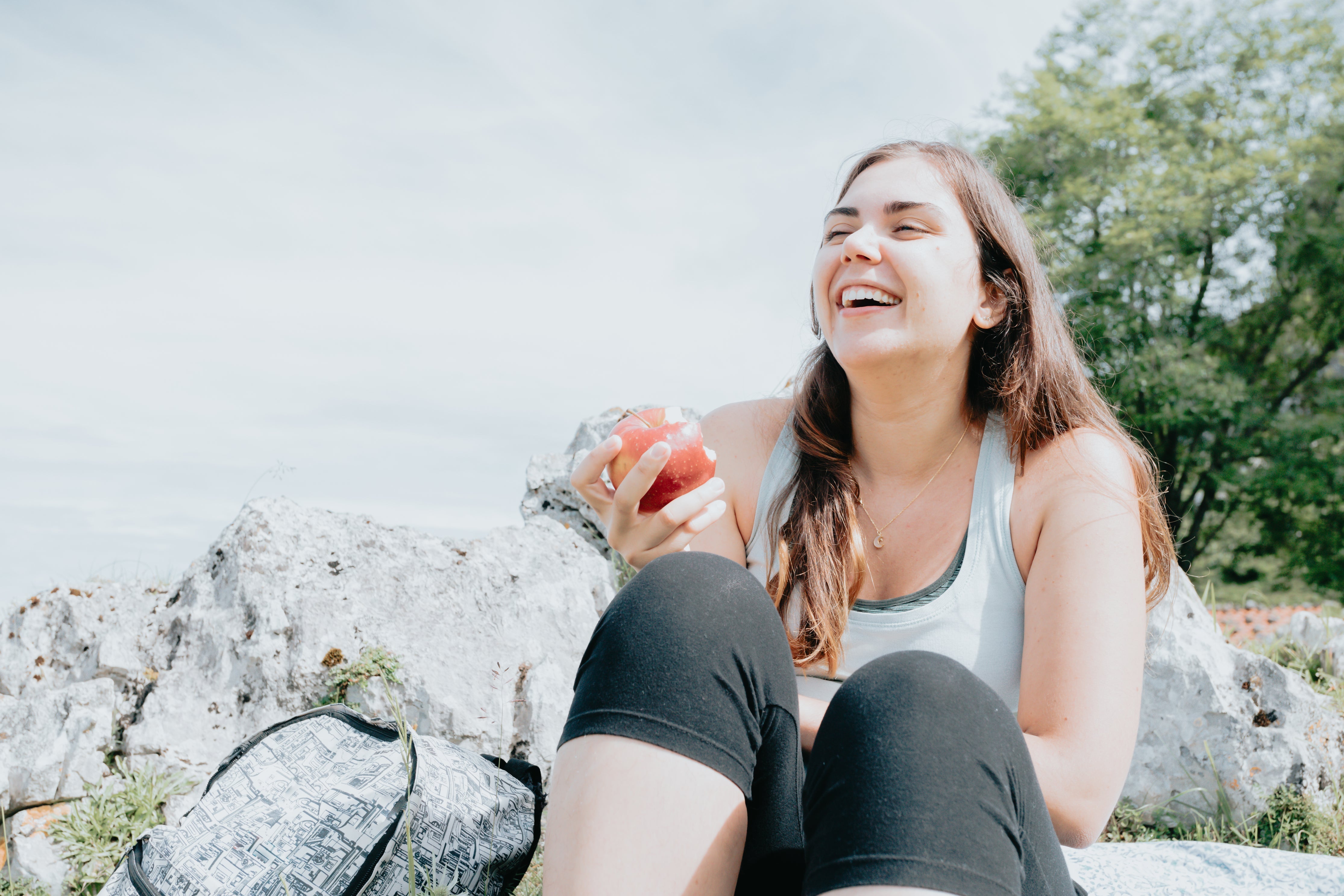 Woman eating apple