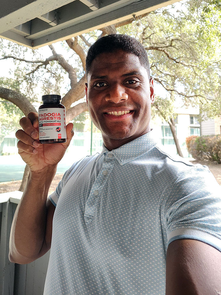 man holding Fadogia Agrestis bottle