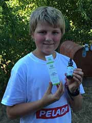 Boy holding Liquid Chlorophyll bottle and box